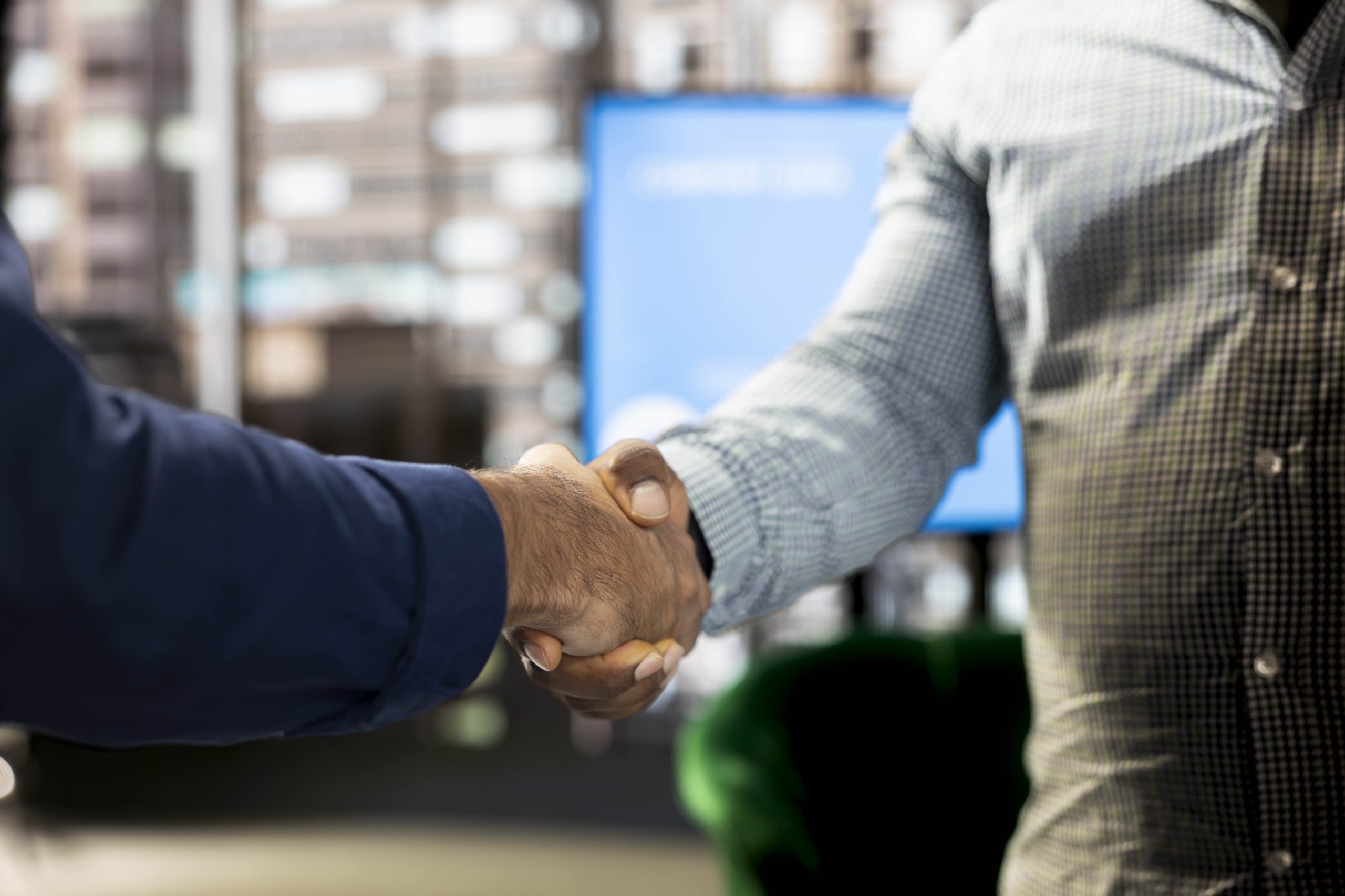 close up of man talking to office director, doing handshake reaching agreement